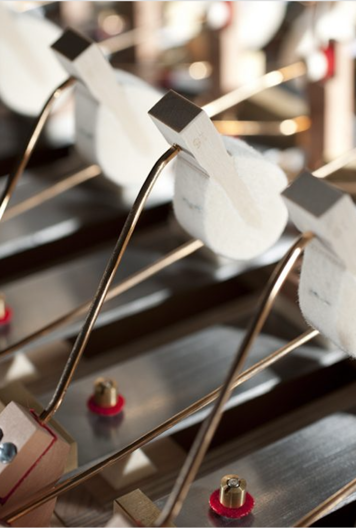 Celesta hammers and felt dampers above the steel sound plates